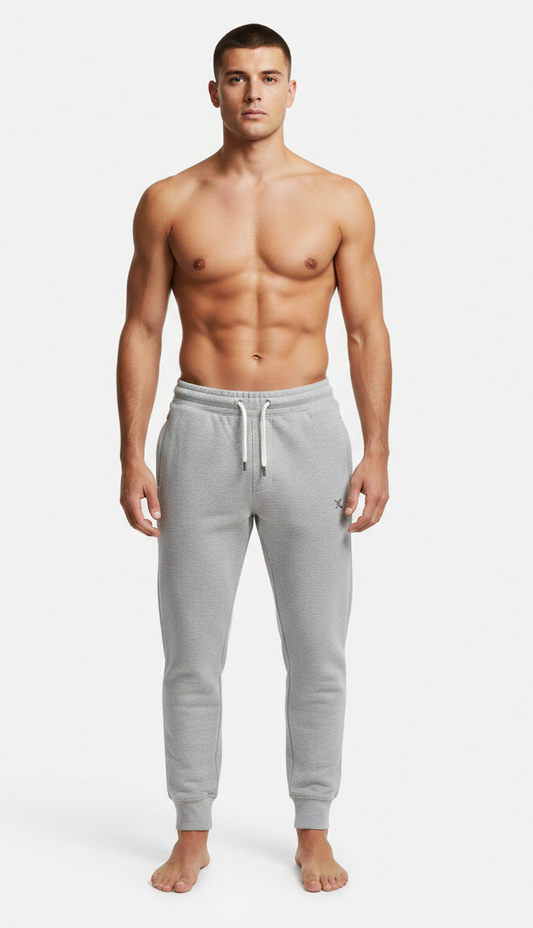 Male model wearing premium Grey athletic joggers on white background front view