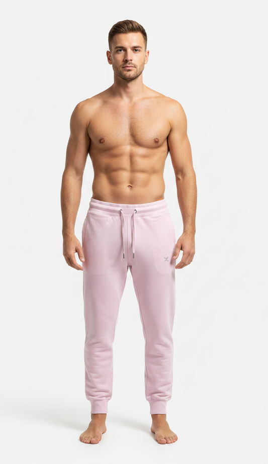 Male model wearing premium Pink athletic joggers on white background front view