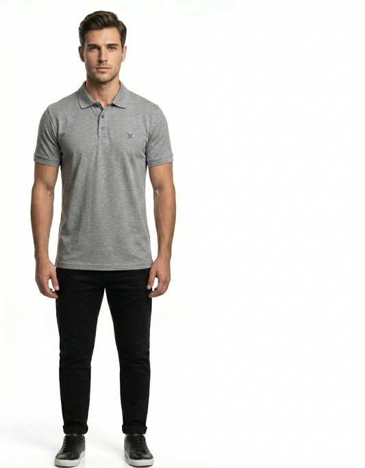 Man wearing a gray polo shirt and black pants on a white background