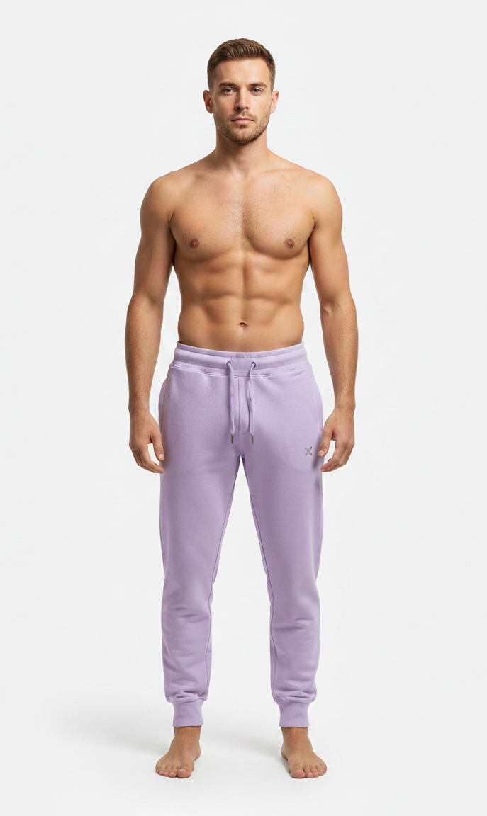 Male model wearing premium lavender athletic joggers on white background front view