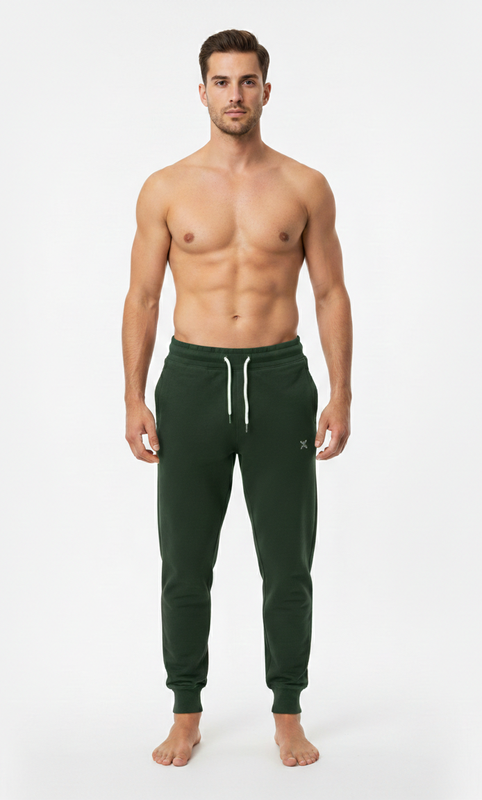 Male model wearing premium Bottle Green athletic joggers on white background front view